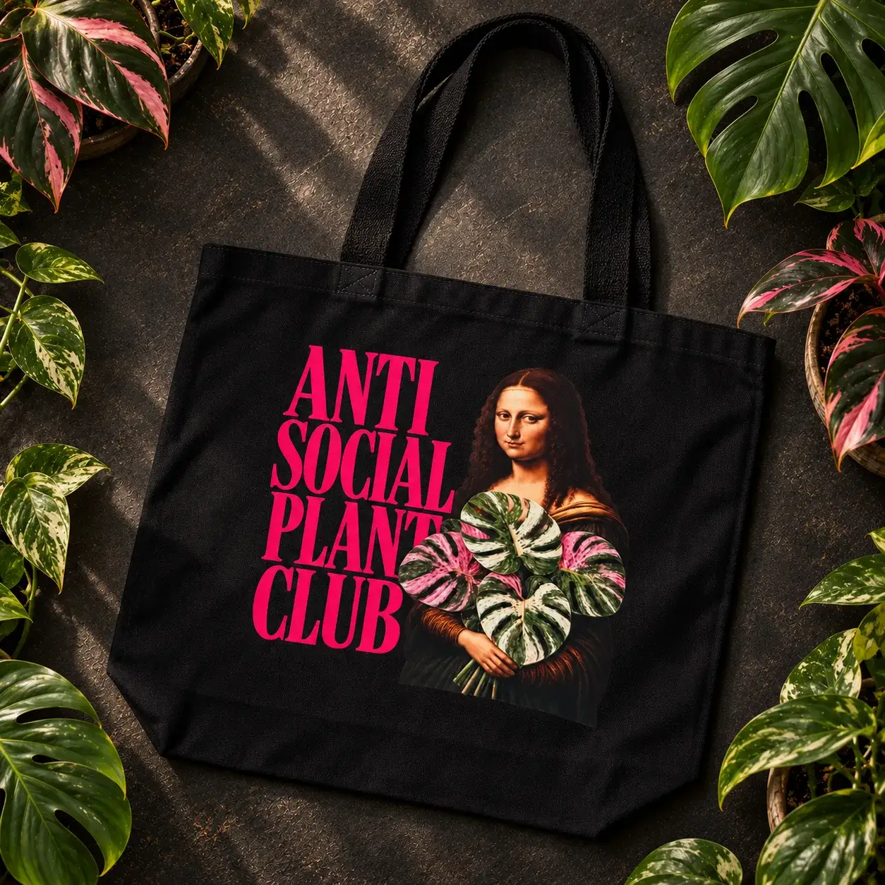 Black tote: Anti Social Plant Club with the Mona Lisa and a variegated monstera