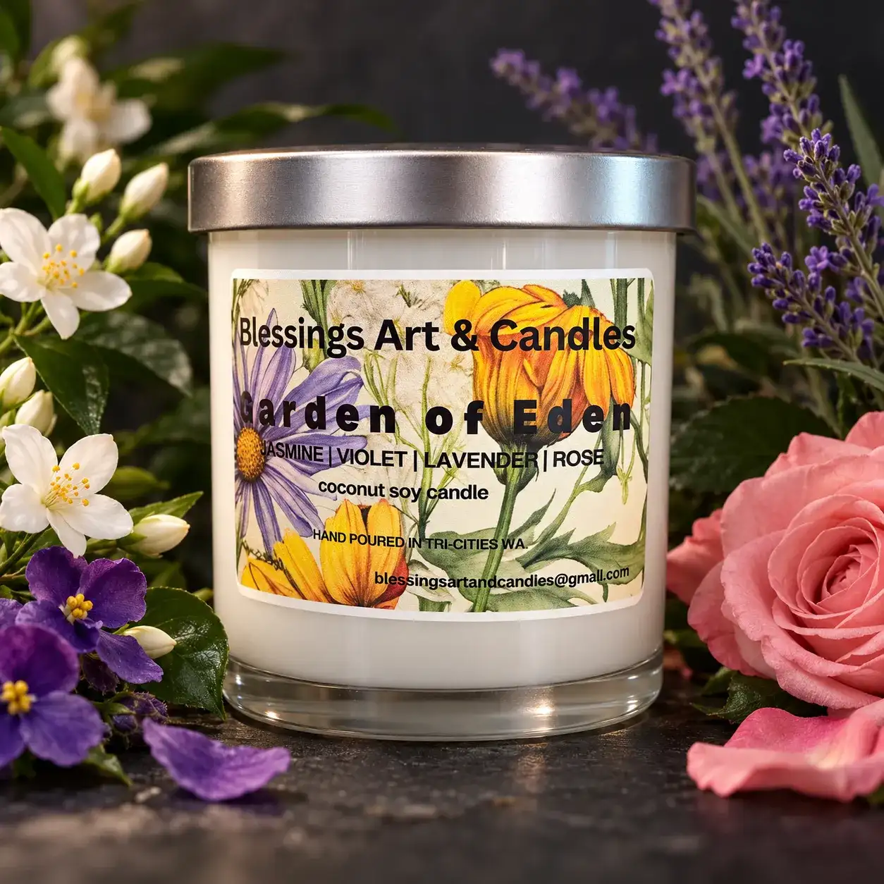 Garden of Eden candle with a floral label, among roses, violets and lavender