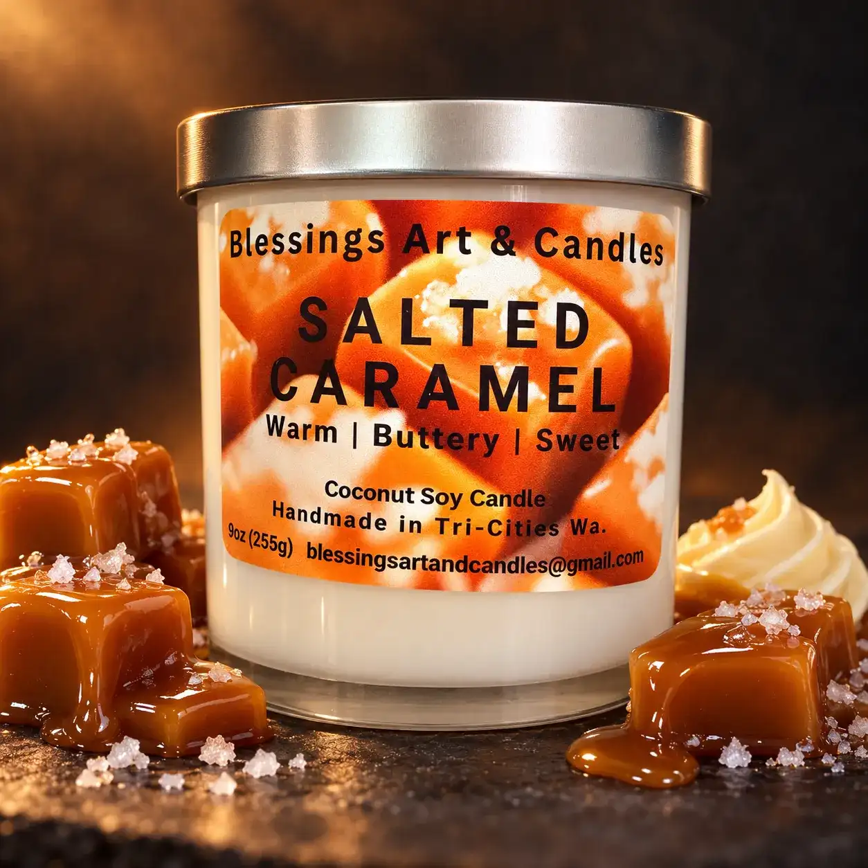 Salted Caramel candle in a glass jar with caramel squares and flakes of sea salt