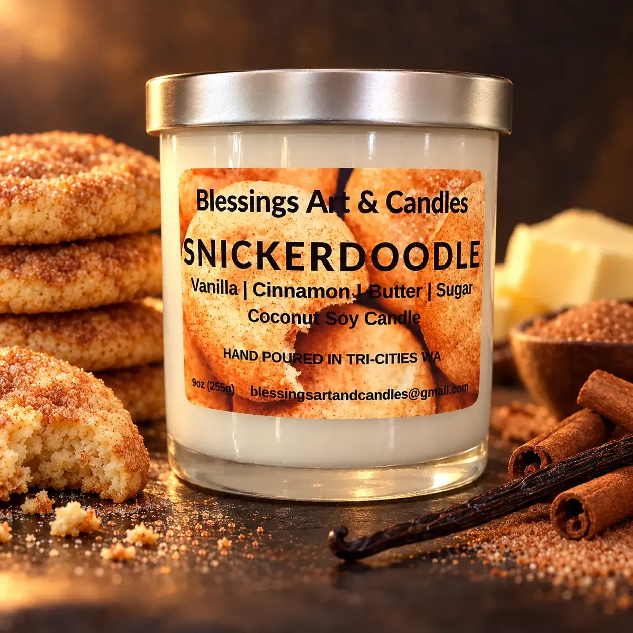 Snickerdoodle candle in a glass jar with cinnamon sugar cookies and cinnamon sticks