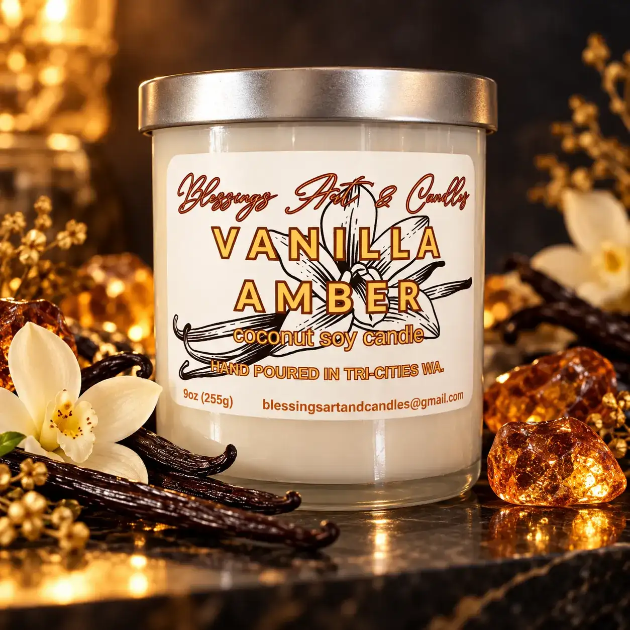Vanilla Amber candle in a glass jar next to vanilla beans and white blossoms