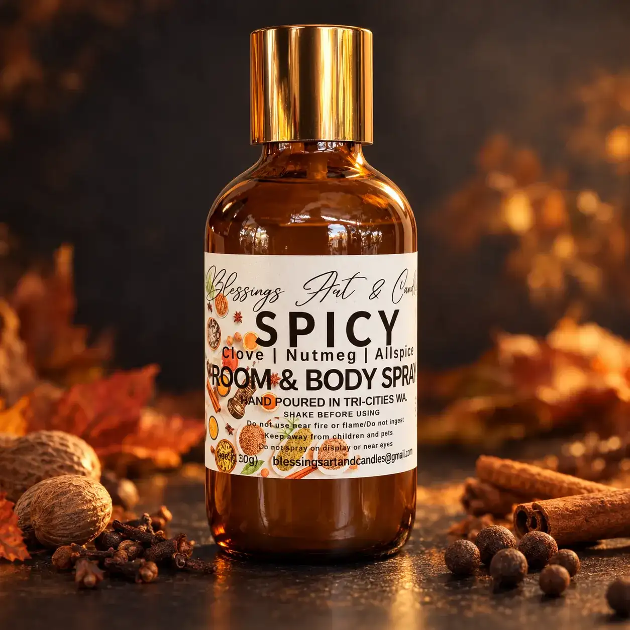 Spicy room and body spray in an amber glass bottle, with cinnamon and fall leaves
